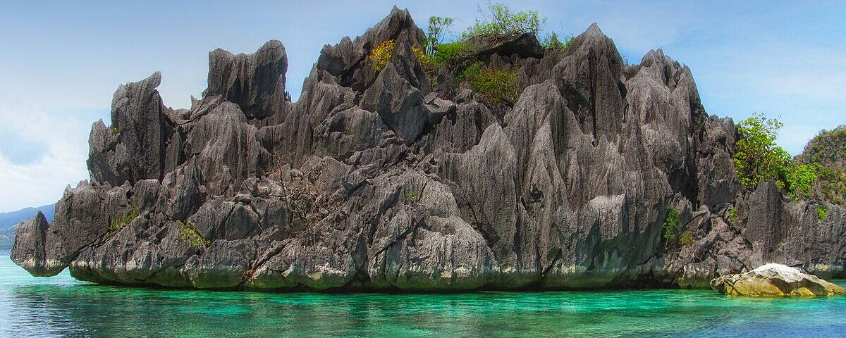 Coral-encrusted porthole on the Morazan Maru wreck in Coron Bay, Philippines