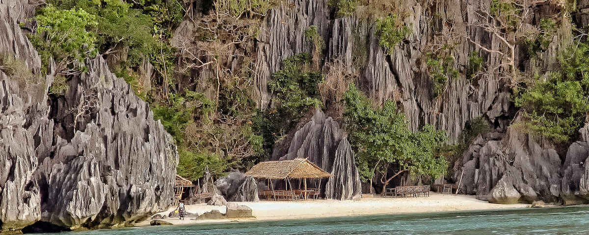 Coral-encrusted WWII shipwreck sitting upright in Coron Bay, Philippines